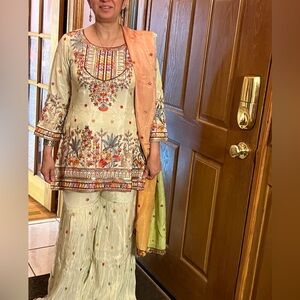 Embroidered Cream short kurta set with Sharara bottoms, green orange dupatta